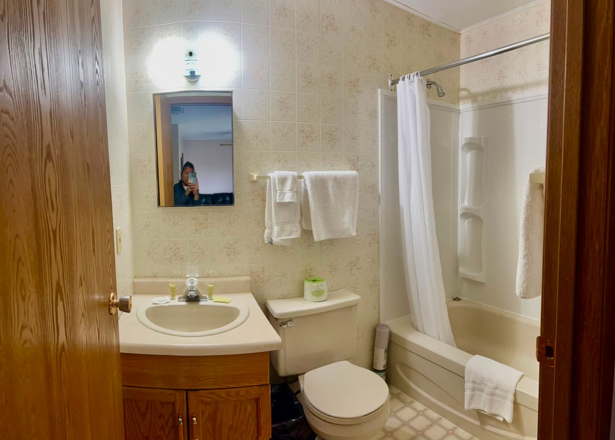 Private bathroom with vanity, tub and shower in a Birch Grove apartment
