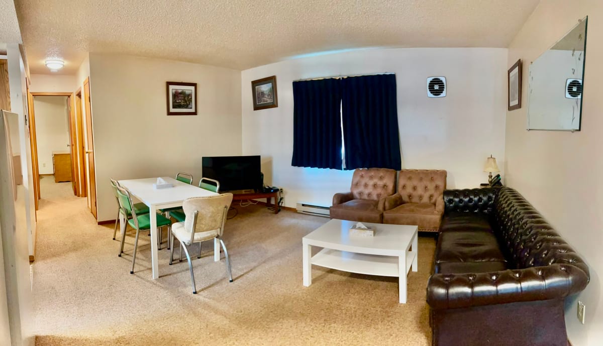 Open living and dining area in a 2 Queen Bedroom Apartment at Birch Grove