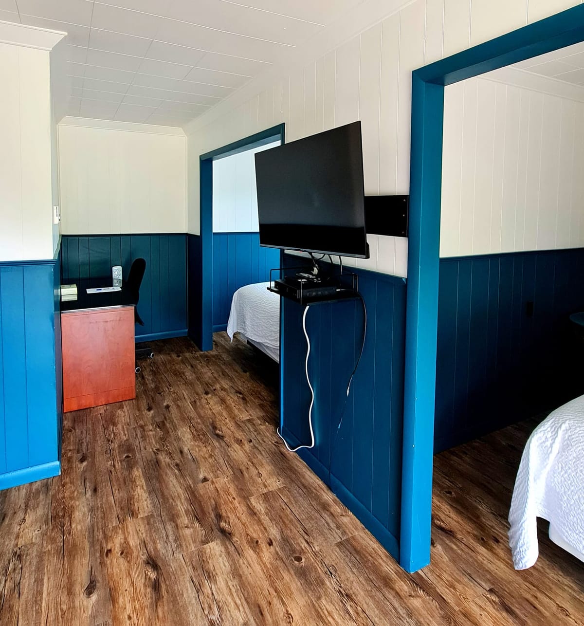 Standard Double Queen room with a work desk and two queen beds at Norwest