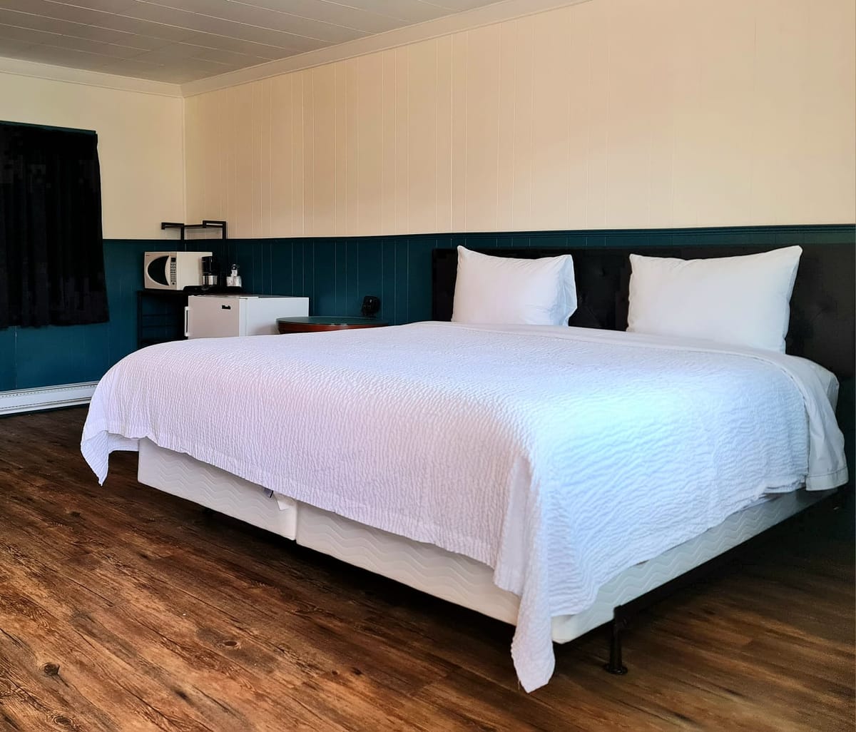 Spacious king bed in a newly renovated Standard King room at The Voy's Norwest branch