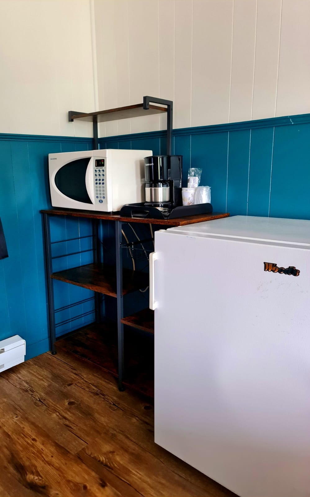 Kitchenette with microwave, coffee maker and mini-fridge in a Norwest Standard Queen room